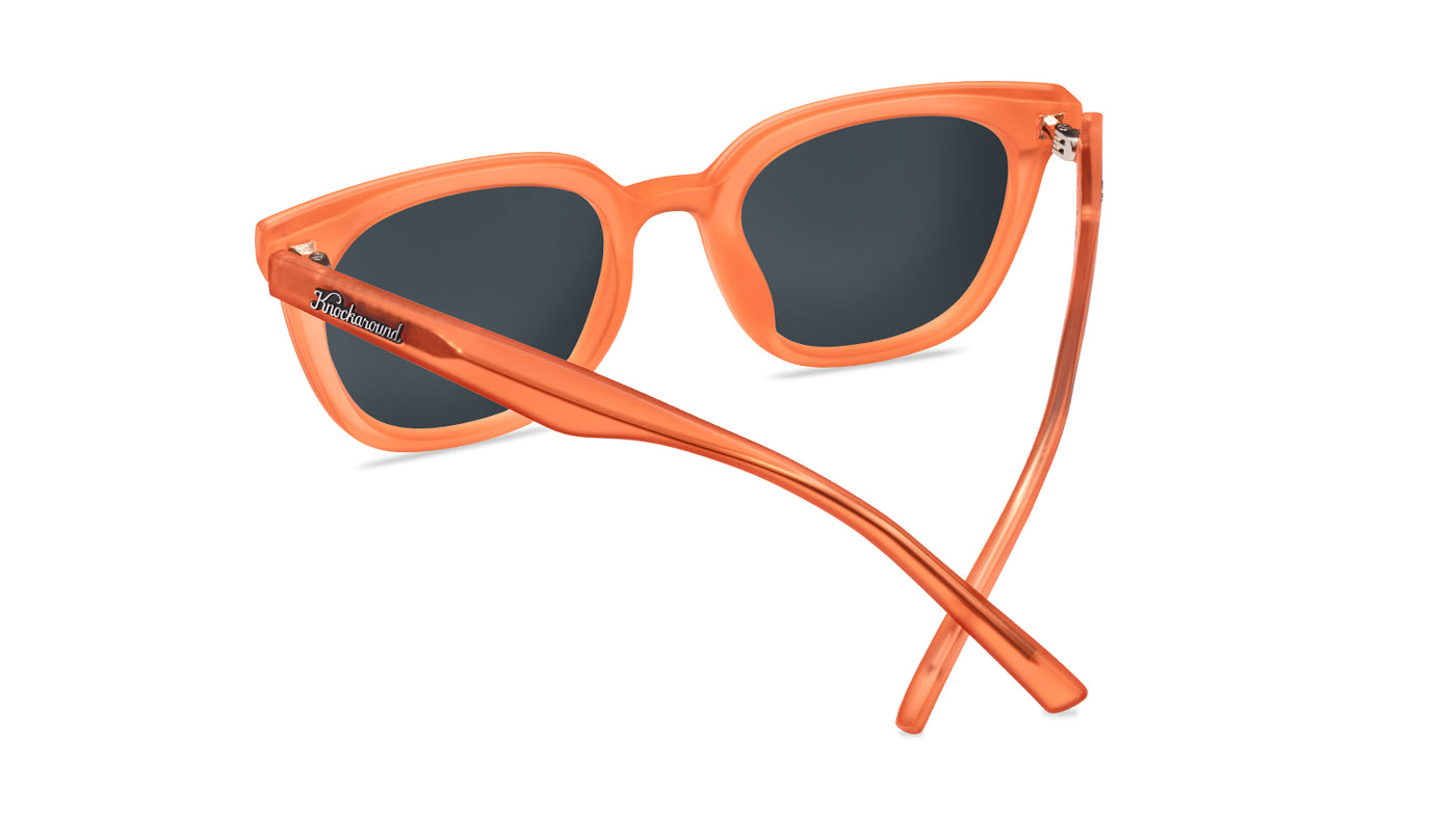 Sunglasses with an orange frame with polarized orange lenses, back