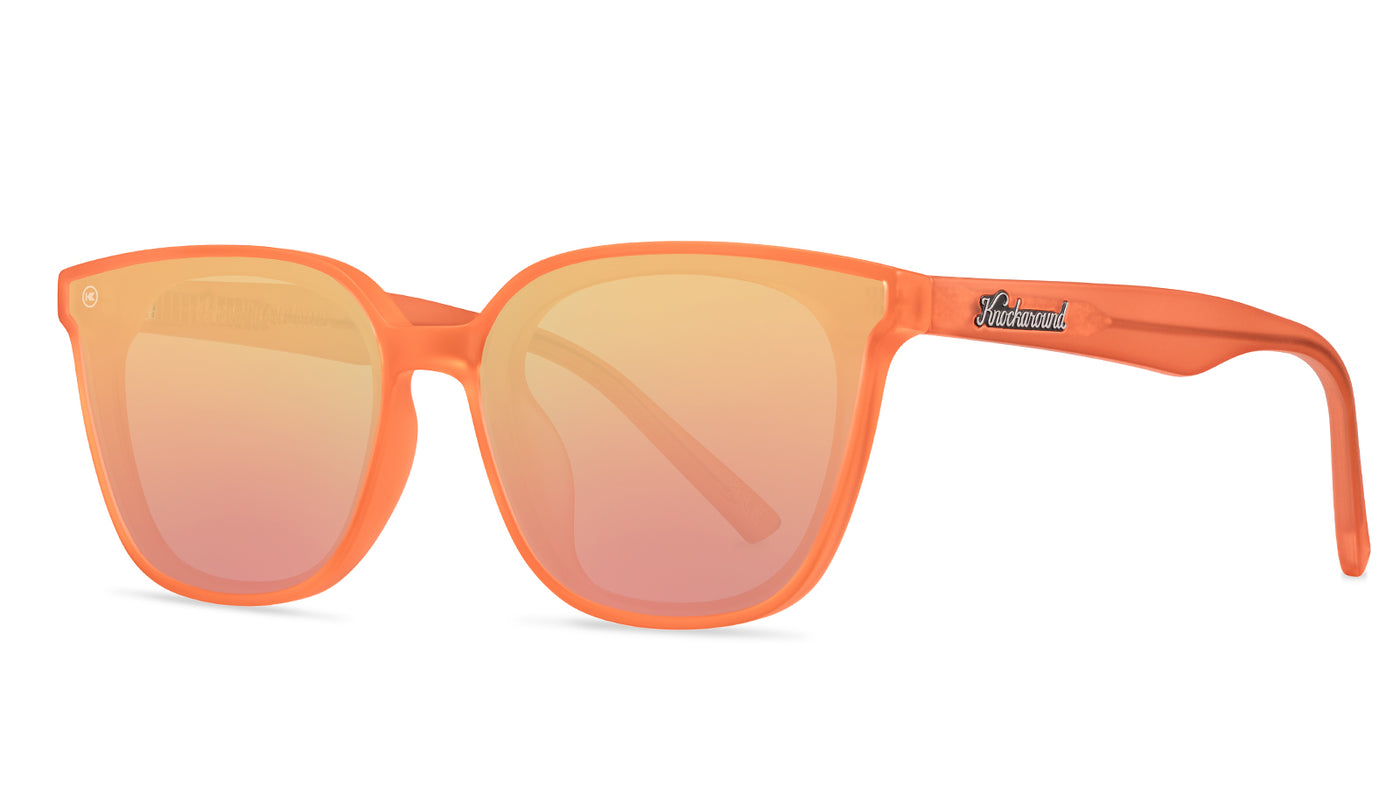 Sunglasses with an orange frame with polarized orange lenses, threequarter