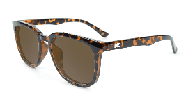 Glossy black tortoise sunglasses with amber lenses