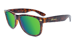 Glossy tortoise shell sunglasses with green lenses