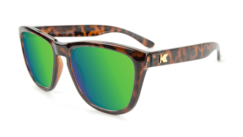 Glossy tortoise shell sunglasses with green lenses