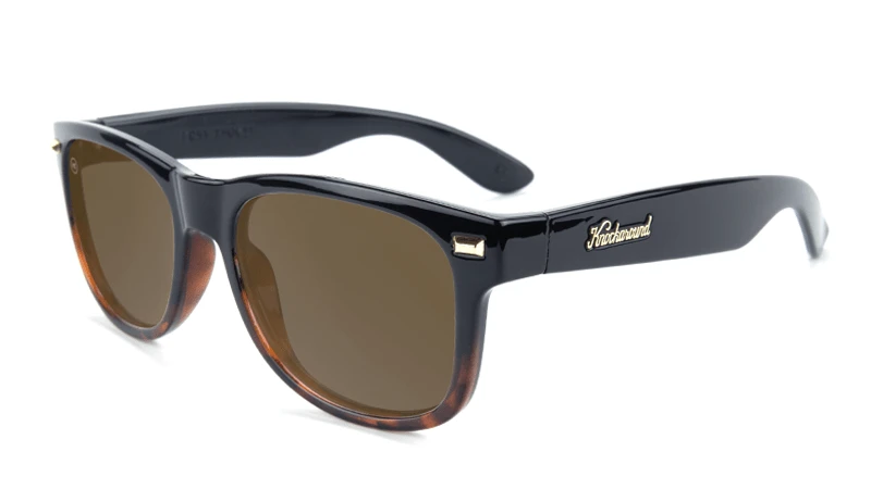 Glossy black sunglasses with square amber lenses