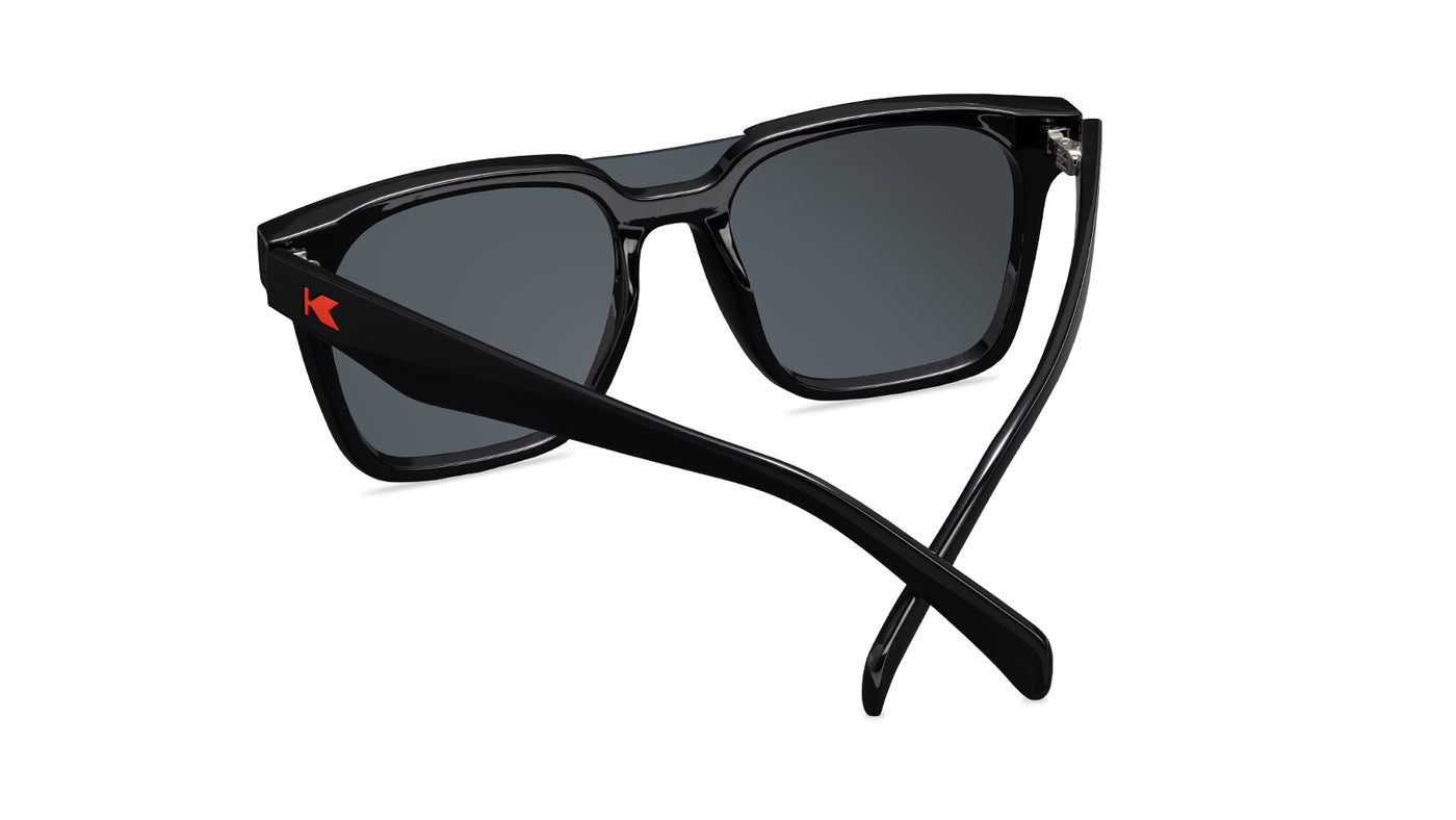 Sunglasses with a black frame with polarized orange lenses, back