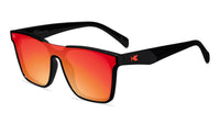 Sunglasses with a black frame with polarized orange lenses, flyover