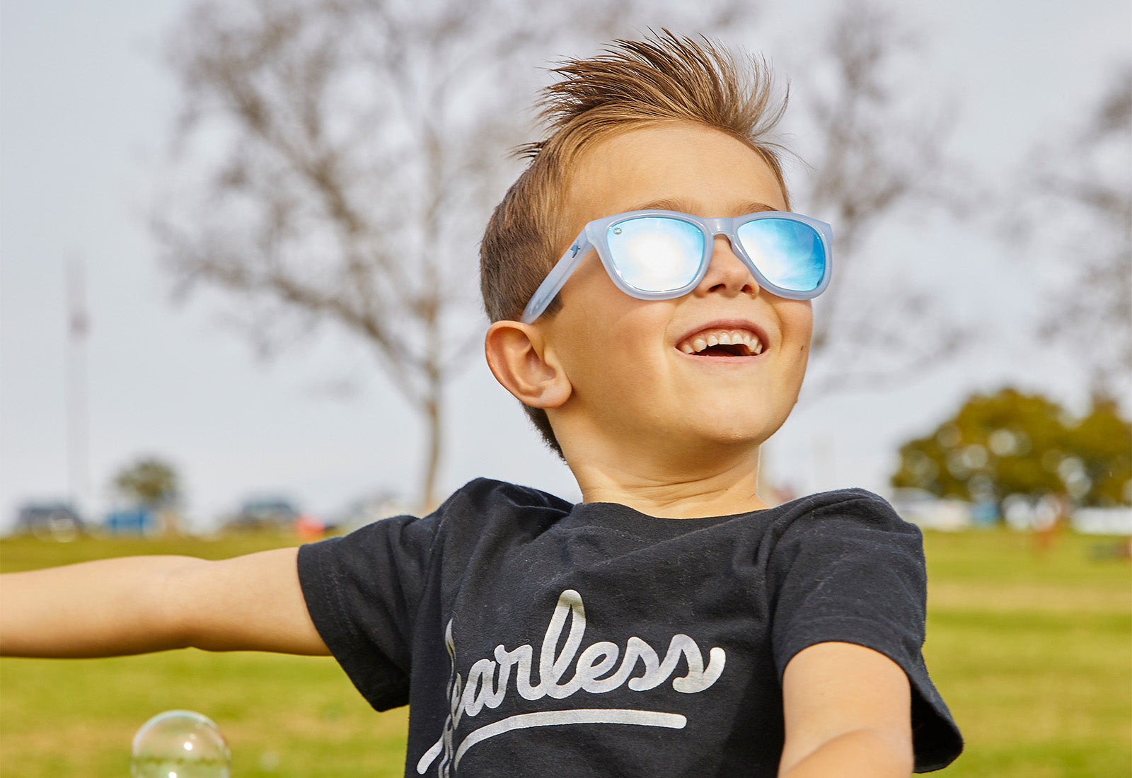 A boy kid wearing sunglasses