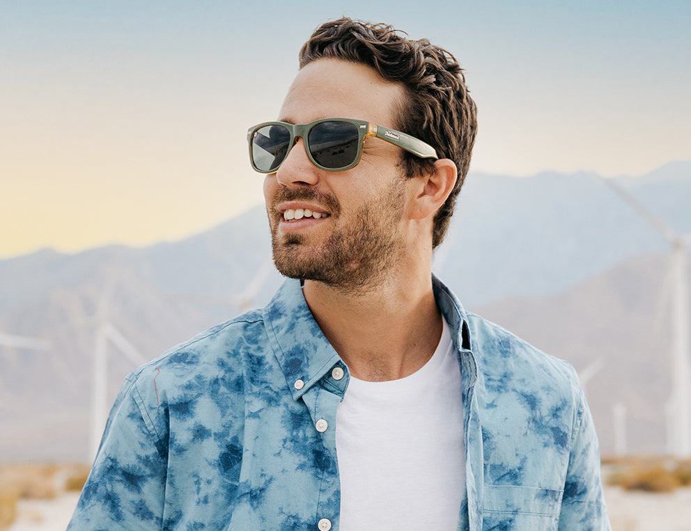 Gift Guide For Him: Man wearing Coyote Calls Fort Knocks sunglasses