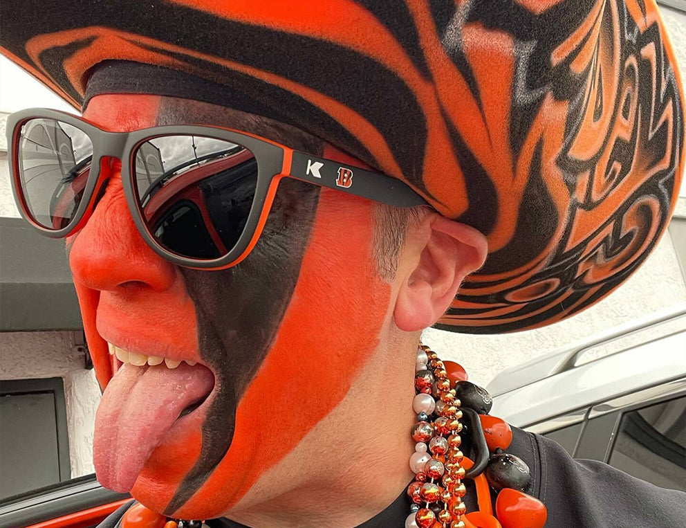 Gift Guide For The Sports Fan: Man wearing Cincinnati Bengals Premiums Sport sunglasses