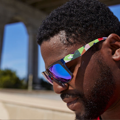 Sunglasses with Cubic Pattern Frames and Polarized Green Lenses, Male Model