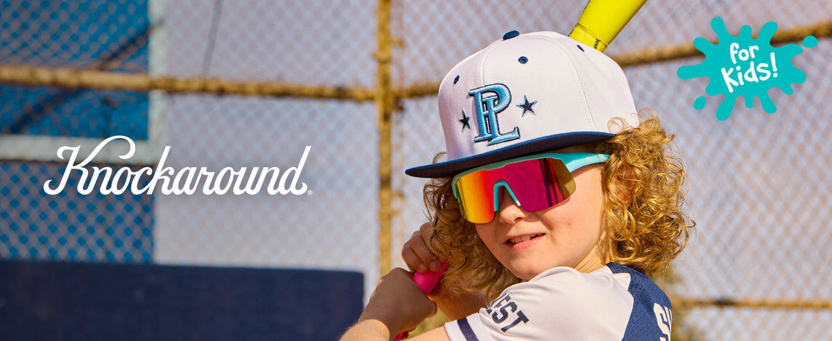 Boy wearing Wild Card / Pink Sunset Kids Volts Sunglasses.