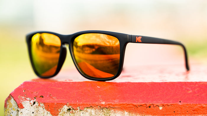 Sunglasses with Matte Black Frames and Polarized Red Sunset Lenses