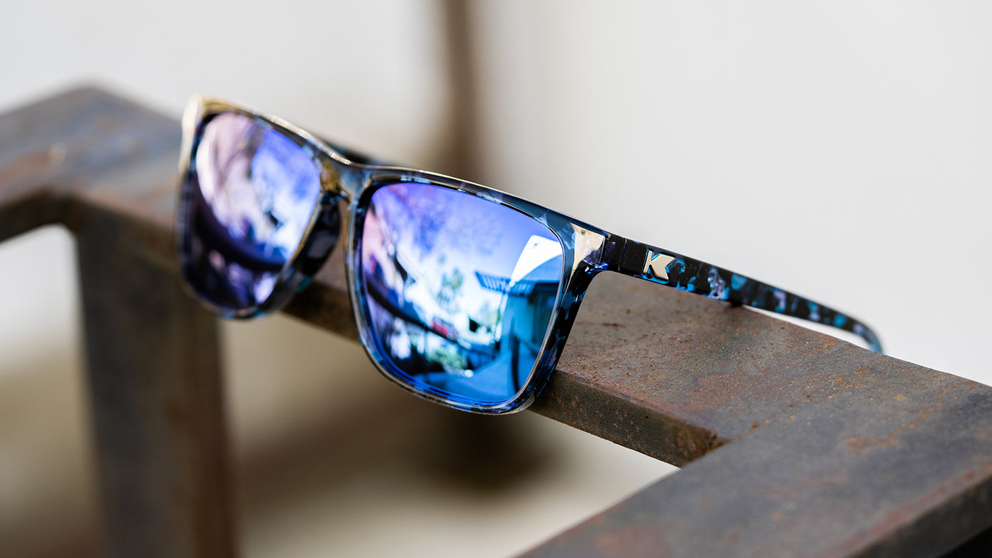 Sunglasses with Indigo Ink Frames and Polarized Snow Opal Lenses