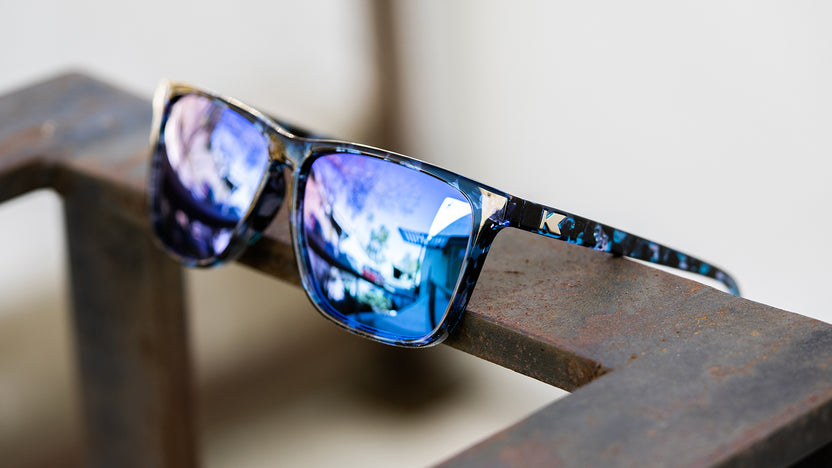 Sunglasses with Indigo Ink Frames and Polarized Snow Opal Lenses