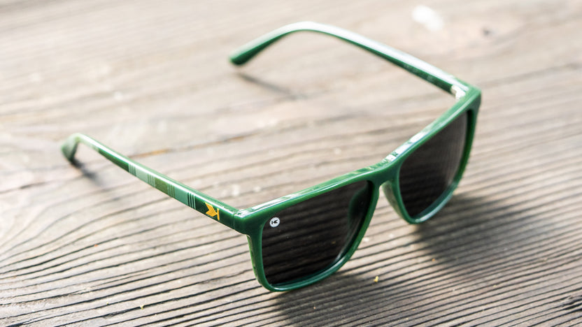 Sunglasses with Forest Green frames and Polarized Smoke Lenses