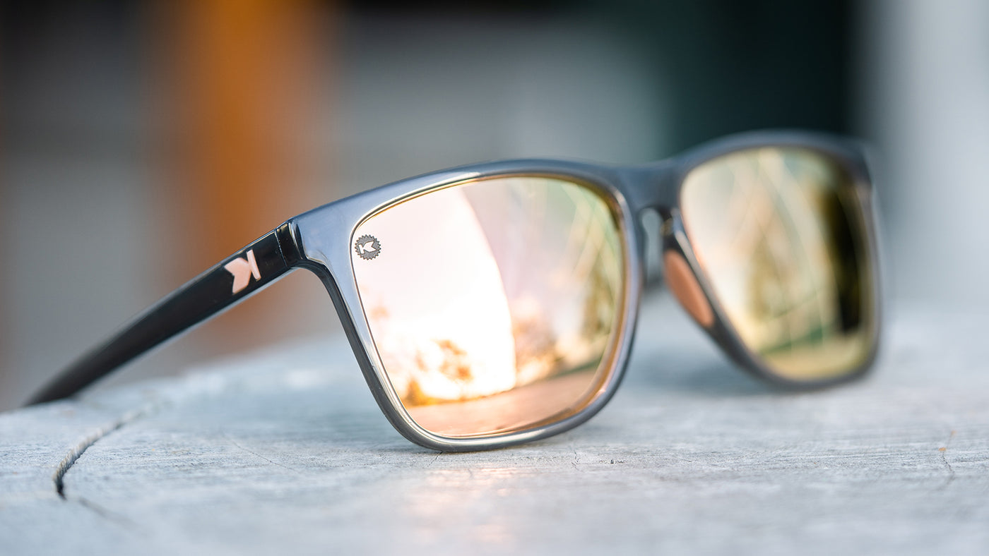 Sunglasses with Grey Frames and Polarized Peach Lenses