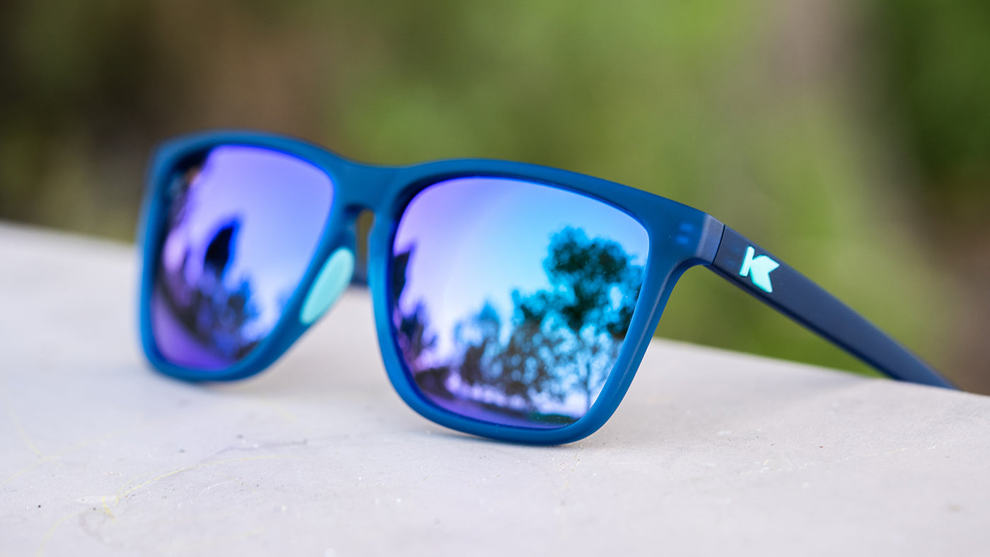 Sunglasses with Navy Frames and Polarized Mint Green Lenses