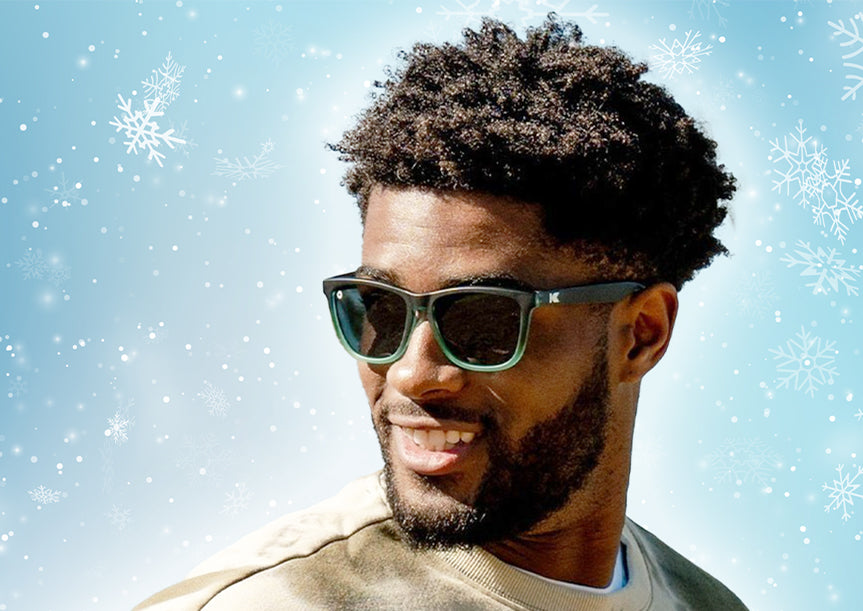 Gift Guide For Him: Man wearing Rising Tide Premiums sunglasses