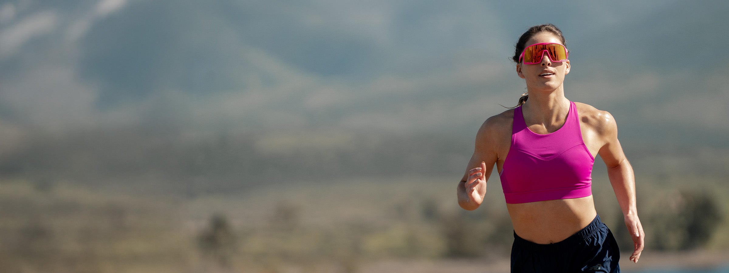 Woman running with Knockaround sunglasses on. One Day Only Sale