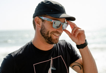 Man wearing shark week sunglasses