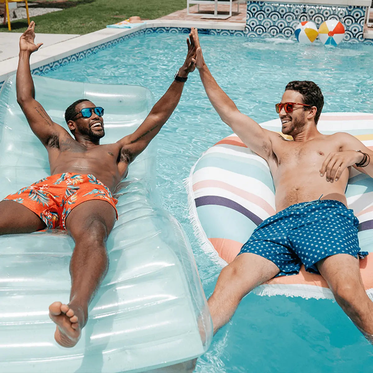 image of two men on pool floats