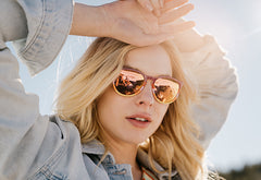 Sunglasses with Mesa Horizon-inspired frames and polarized rose gold, model