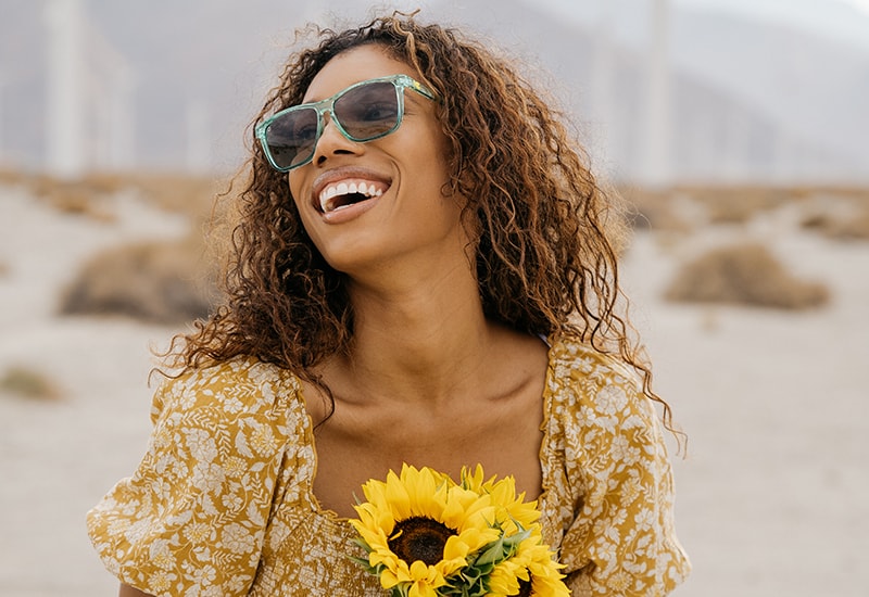 Sunglasses with a Green Frame and Polarized Amber Gradient Lenses, Model