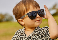 Kids Sunglasses with glossy Fronts and Checkerboard Arms with Polarized Black Smoke Lenses, Model