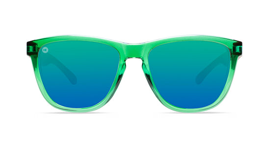 Sunglasses with glossy green fronts, wooden arms and polarized green lenses, front